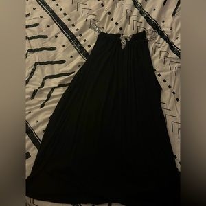 Black sleeveless top with silver chain collar